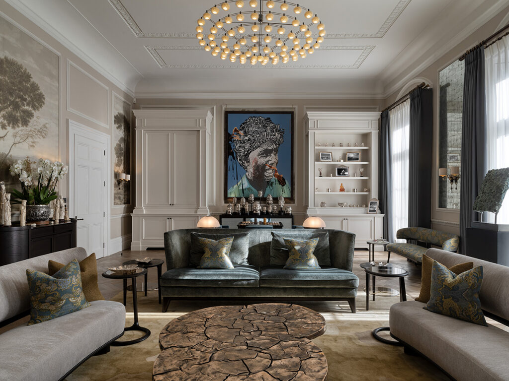 The red thread in interior design — a Belgrave Mansion reception where art and sculpture anchor the scheme.