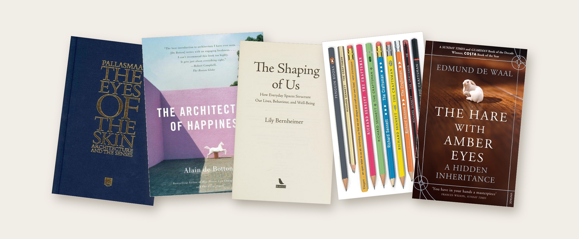 The five books laid out in a row: The Eyes of the Skin, The Architecture of Happiness, The Shaping of Us, The Craftsman and The Hare with Amber Eyes