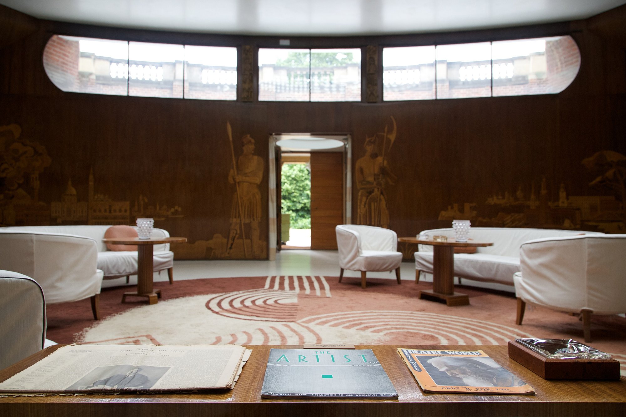 The circular entrance hall at Eltham Palace, Greenwich, lined in blackbean veneer and marquetry