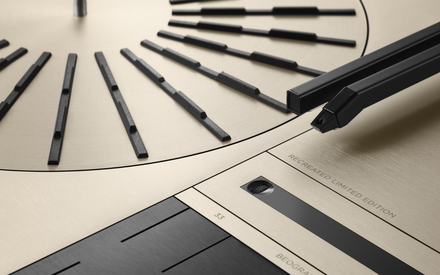 Close detail of the Beogram 4000c turntable in champagne aluminium, showing the platter and tangential arm